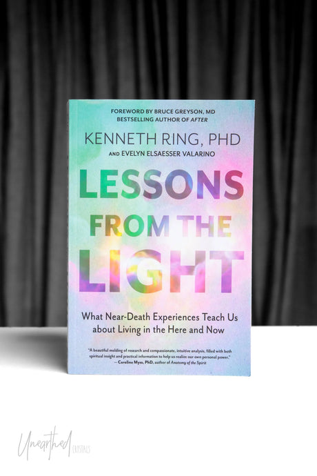 Book titled 'Lessons from the Light' by Kenneth Ring and Evelyn Elsaesser Valarino on a gray background