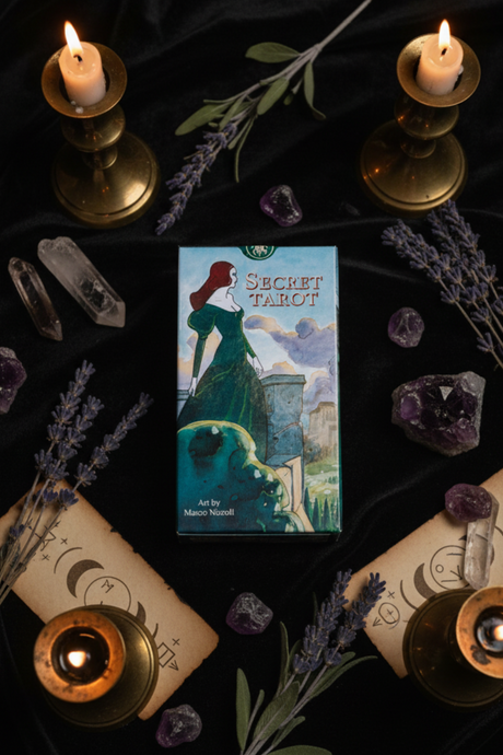 Secret Tarot card with candles, lavender, and crystals on a dark background