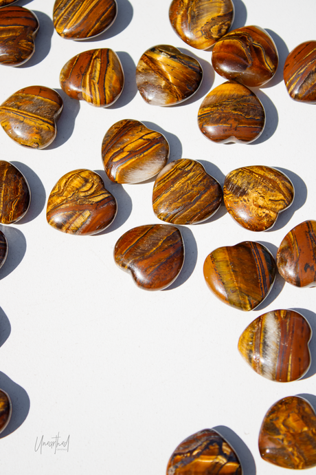 Pattern of tiger eye stones on a white background