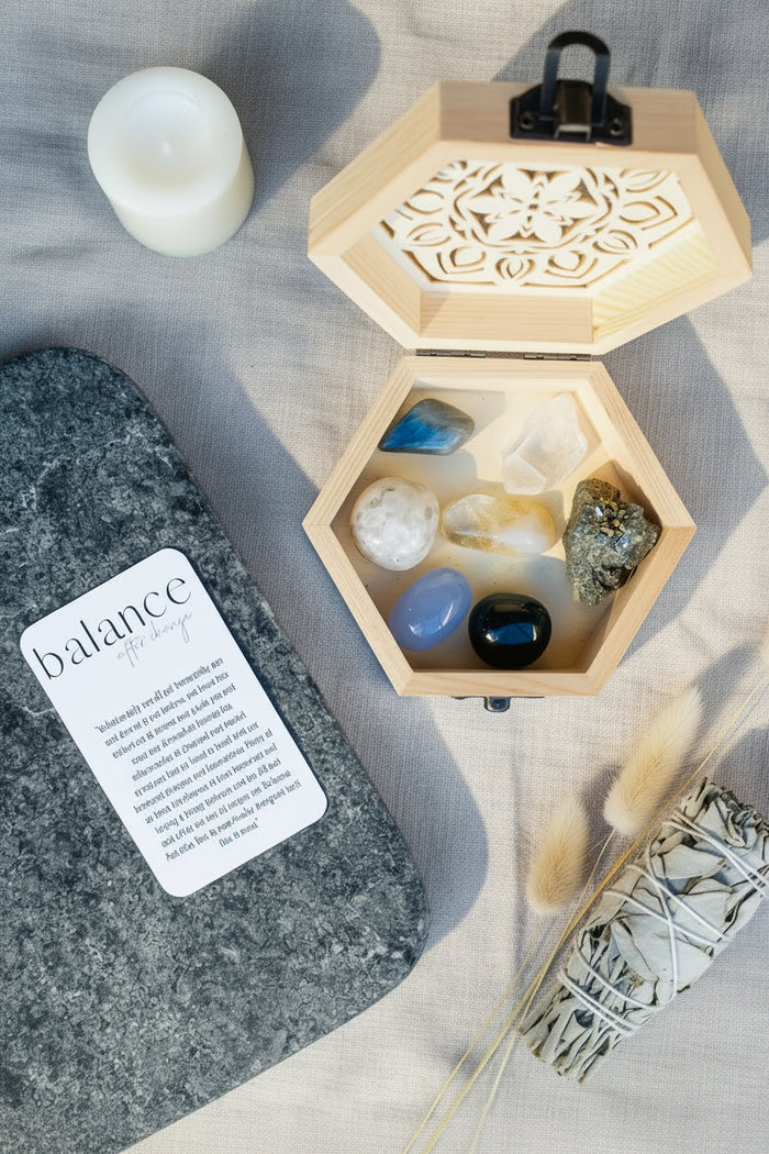 Hexagonal wooden crystal kit containing various healing stones and a balance guidance card.