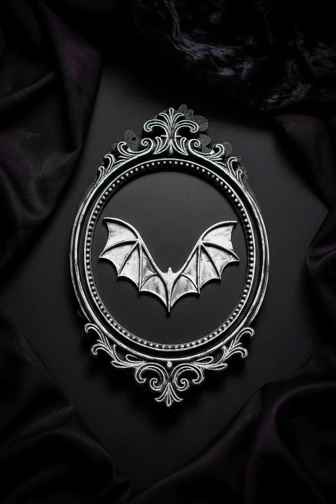 Decorative emblem with a bat design on a dark fabric background