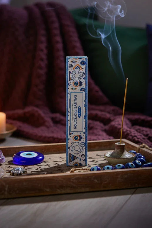 Incense box with 'Evil Eye Protection' text on a plain background