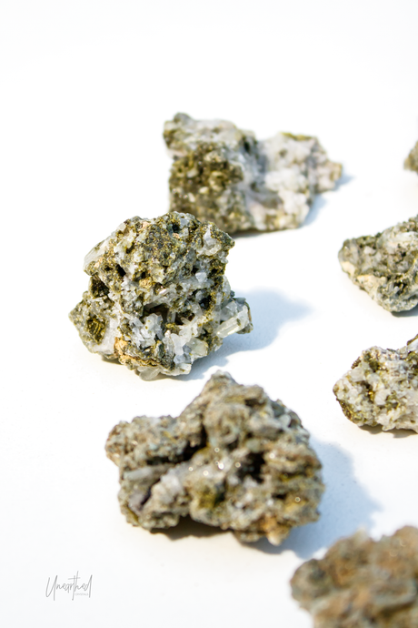 Green Tourmaline Mineral samples on a white background