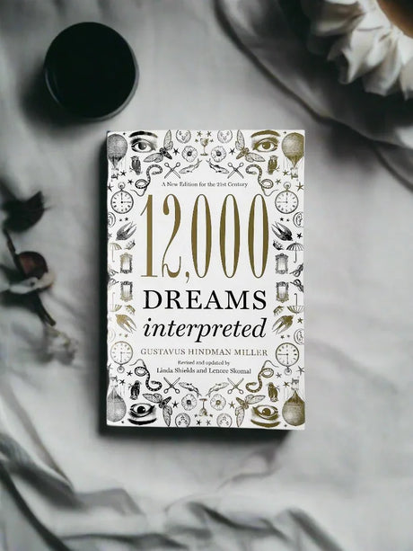 Book titled '12,000 Dreams Interpreted' on a textured surface